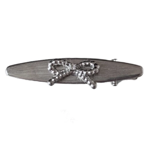 Elegant silver brushed metal bow hair clip with a sparkling rhinestone center for women