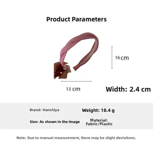 Dimensions du serre-tête rose en tissu torsadé montrant 16 cm de haut et 2,4 cm de large