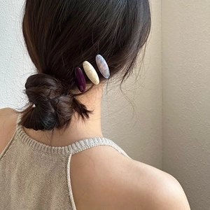 Three-piece set of macaron oval acetate hair clips in purple and beige marble textures