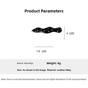 Polka dot fabric hair clip with leather finish and alloy base, 7.8cm size detail