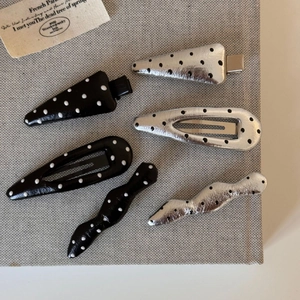 6-piece set of leather polka dot hair clips in silver and black colors and varied shapes