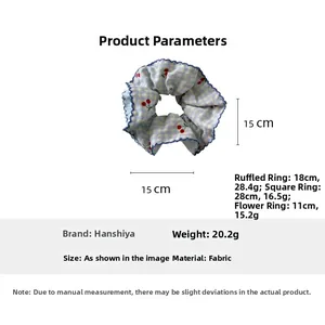 Detailed view of blue plaid cherry scrunchie with scalloped edges and 15cm size diameter