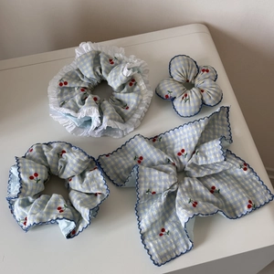 Detail of blue plaid cherry hair accessories set with lace scrunchie and large bowknot