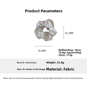 Spécifications de taille pour chouchou en tissu blanc avec motif à pois colorés
