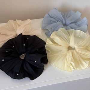 Set of four chiffon pearl scrunchies in cream, blue, black, and yellow tones