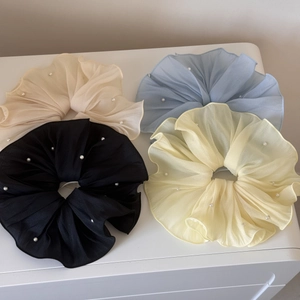 Set of four oversized chiffon scrunchies in pastel colors with small pearl details