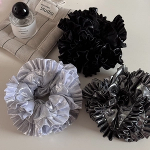 Three-piece set of large metallic satin scrunchies in silver, black and gunmetal grey