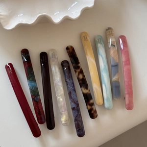 Set of ten colorful marble acetate barrettes with French style design and glossy finish