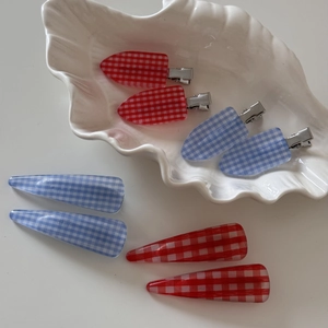 Set of 8 red and blue gingham hair clips in a white decorative shell tray
