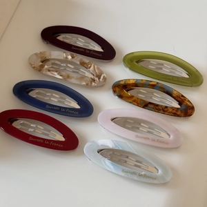 Detailed set of 8 oval acetate hair barrettes in various marble and solid colors