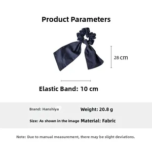 Vista dettagliata dell'elastico per capelli in denim blu con nastri lunghi 28 cm