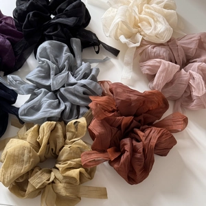Chiffon puff scrunchies in multiple colors including black, beige, pink, and navy blue