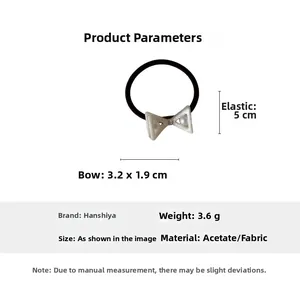 Detailed view of acetate bow hair tie with pearl center and elastic band dimensions