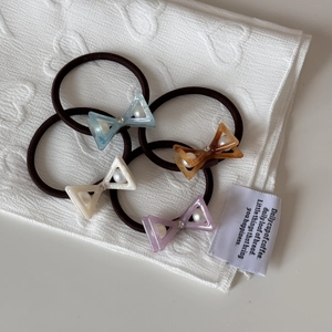 Set of 4 pearl and rhinestone acetate bow hair ties in assorted pastel colors