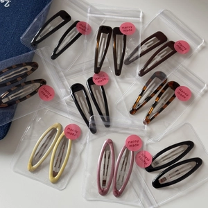Set of 2 stylish leopard print and glossy resin hair clips in various colors