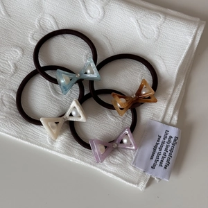 Set of 4 elastic hair ties with pearl rhinestone acetate bows in four pastel colors