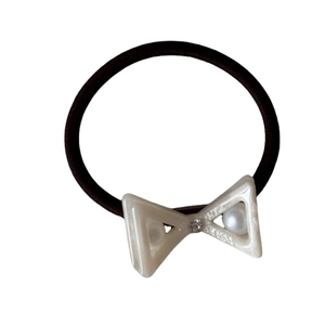 Elastic bow hair tie with rhinestone and faux pearls on cream geometric acetate ornament