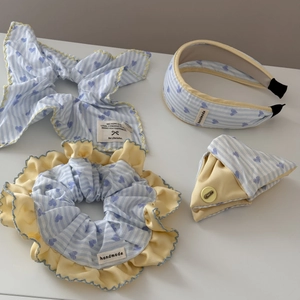 Blue striped hair scrunchie set with heart pattern and yellow frills on white background