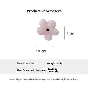Detailed specs of floral hair claw showing acetate material and 2cm product dimensions