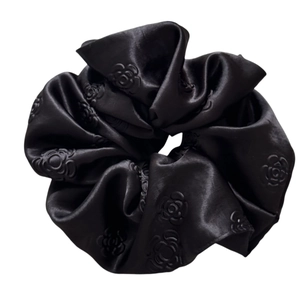 Elegant black satin hair scrunchie with embossed 3D rose pattern for women