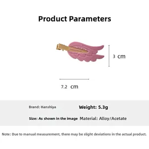 Detail showing pink acetate wing hair clip with rhinestones and size measurements