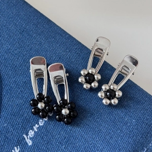 Four-piece silver metal flower hair clips set with black and silver bead petals
