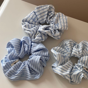 Three-piece set of blue striped hair scrunchies with elegant bow embroidery detail