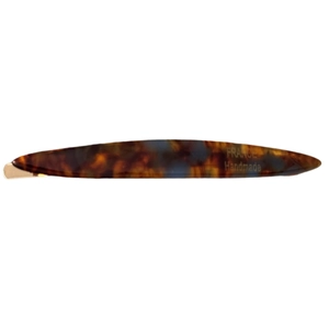 Handmade tortoise shell hair clip with golden base in a sleek leaf-shaped design