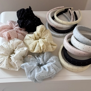 Polka dot fabric headbands and scrunchies set in various pastel colors on white background