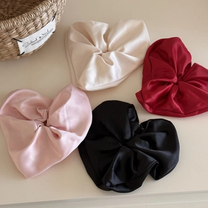 Set of four satin heart-shaped hair scrunchies in white, red, pink, and black colors