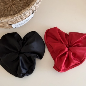 Elegant satin heart-shaped hair scrunchies in classic black and red silk texture