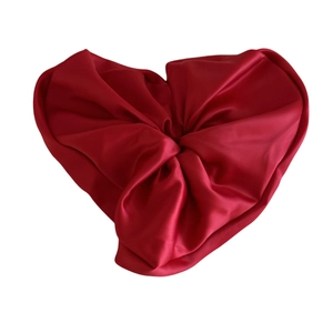 Deep red satin heart-shaped hair scrunchie with a glossy silk texture and elastic band