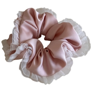 Elegant pale pink satin scrunchie with white ruffled lace edge hair accessory