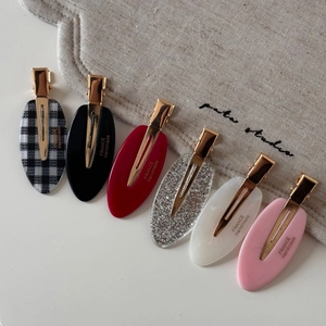 Set of 6 colorful acetate hair clips with golden metal clasp in various elegant patterns
