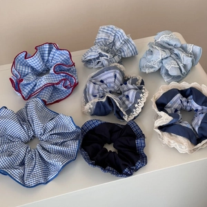 Set of 7 blue and white checkered scrunchies with lace trim and classic striped patterns