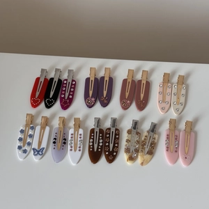 Detailed set of 20 French acetate hair clips with rhinestones and marble patterns