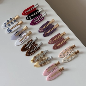 French marble patterned acetate hair clips set with rhinestones and faux pearls