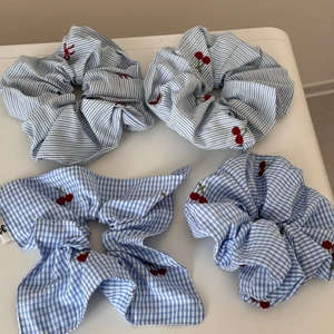 Set of four blue and white checkered scrunchies with cherry embroidery and ribbon bow