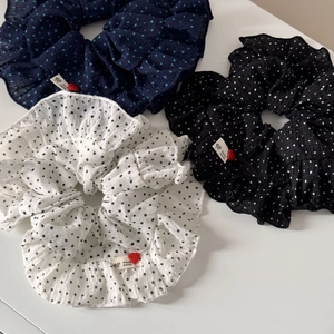 Set of three polka dot ruffled hair scrunchies in navy, black and white colors