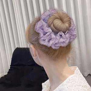 Elegant purple ruffled scrunchie on bun hairstyle, made of lightweight chiffon fabric
