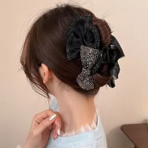Grande molletta per capelli con fiocco in raso nero e strass per acconciature eleganti