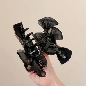 Elegante pinza per capelli con fiocco in organza nera, strass e design a rete