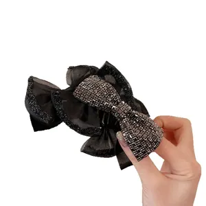 Elegante molletta per capelli a fiocco in rete nera con paillettes e strass luccicanti
