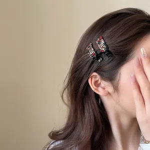 Exquisite colorful rhinestone hair clips for women shown on model side view