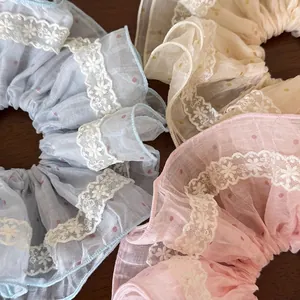 Lace-trimmed polka dot scrunchies in pastel colors for women's hair styling