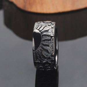 Vintage punk sun relief ring in titanium steel with black oxidized textured finish