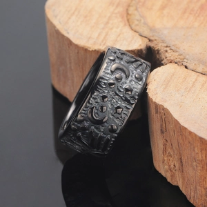 Retro punk style matte black stainless steel ring with moon and sun relief carvings