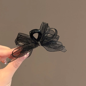 Elegant black organza bow hair claw clip with shimmering glitter and rhinestone detail