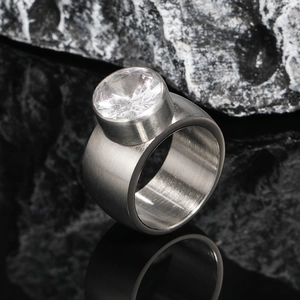 Modern industrial style brushed stainless steel men's ring with a large circular zircon stone