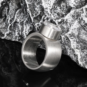 Mens brushed stainless steel ring with a large round zircon stone in an industrial style